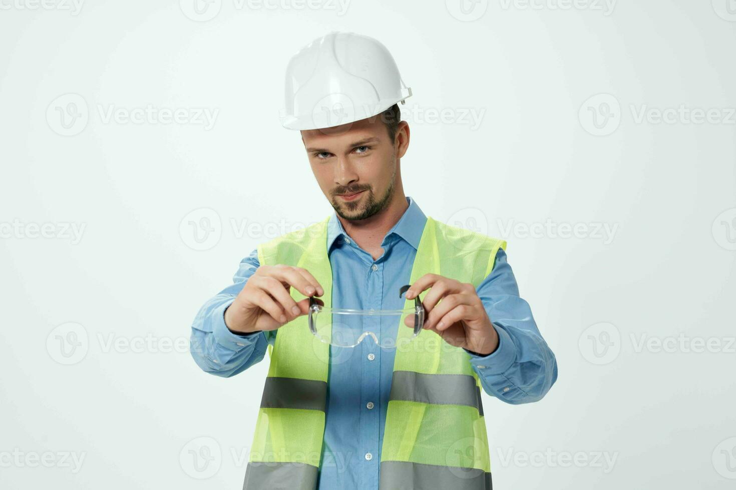 man reflective vest Professional Job light background photo