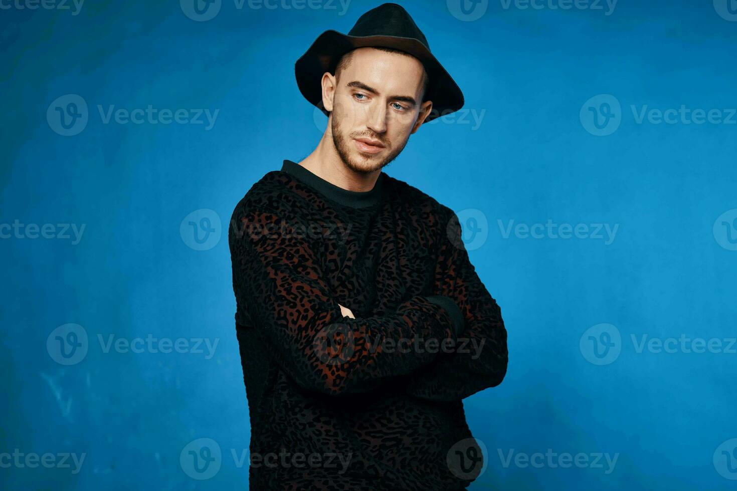 Cheerful man in black hat fashion modern style posing photo