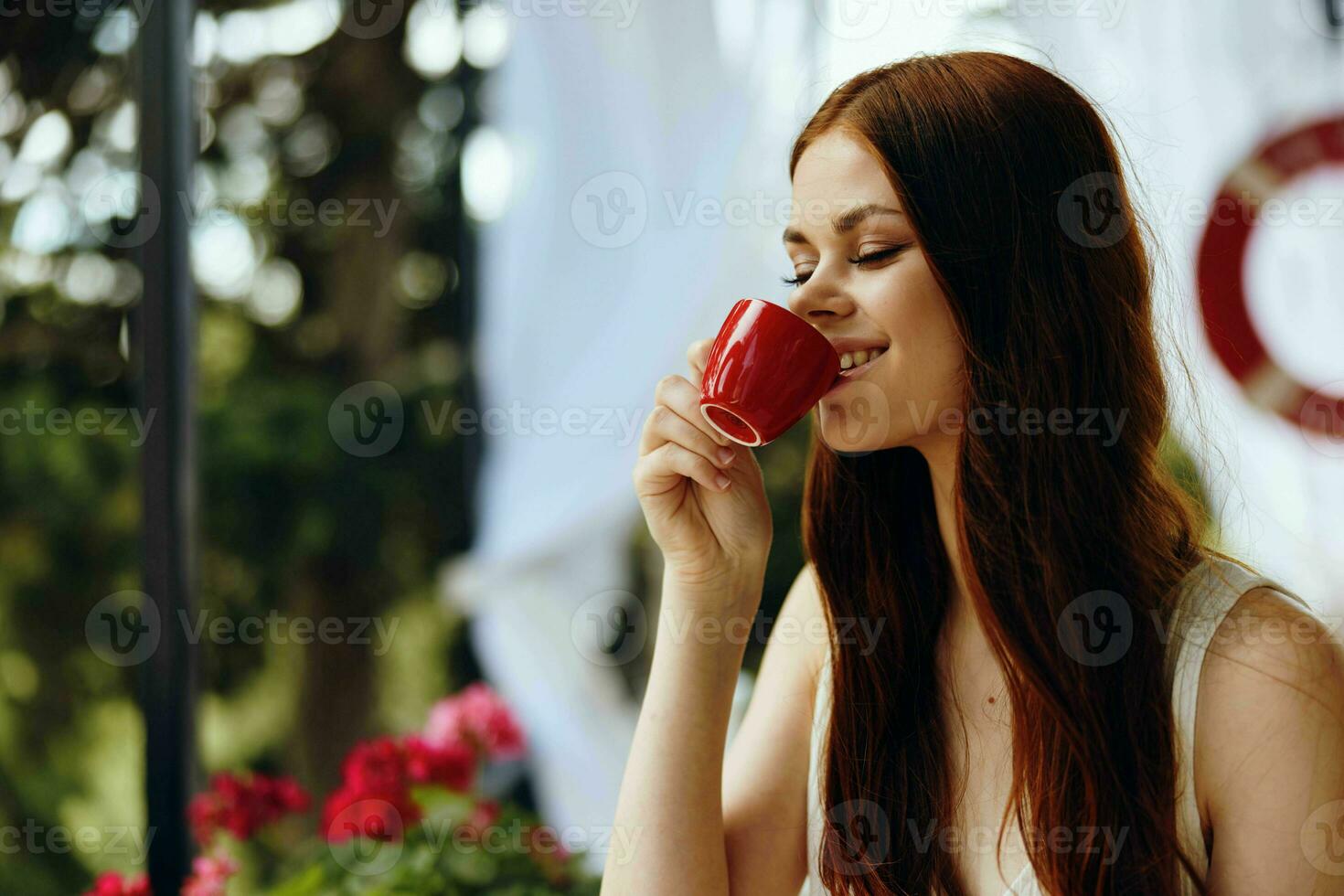 beautiful woman drinking coffee outdoors Relaxation concept photo