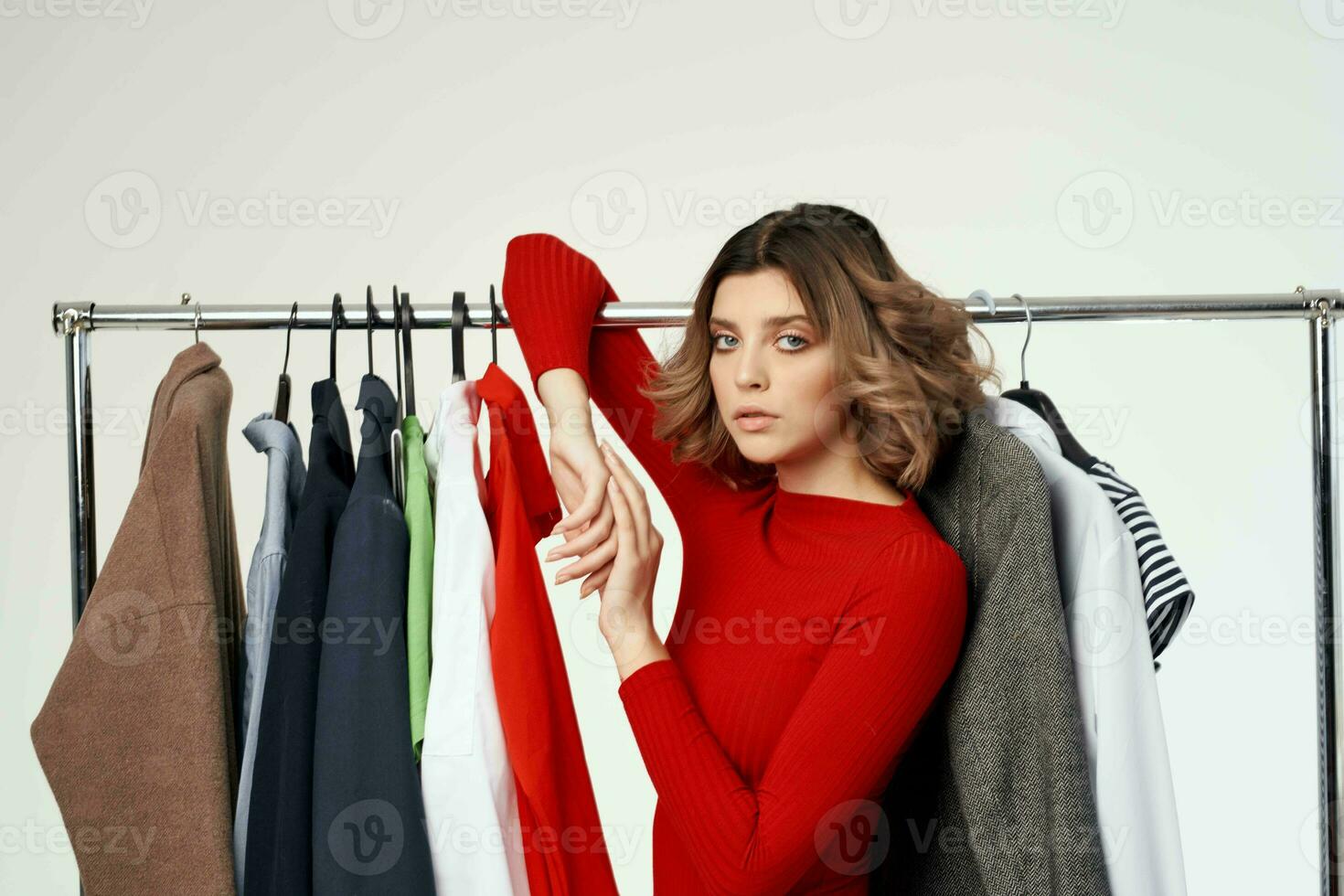 pretty woman next to clothes fashion fun retail emotions photo