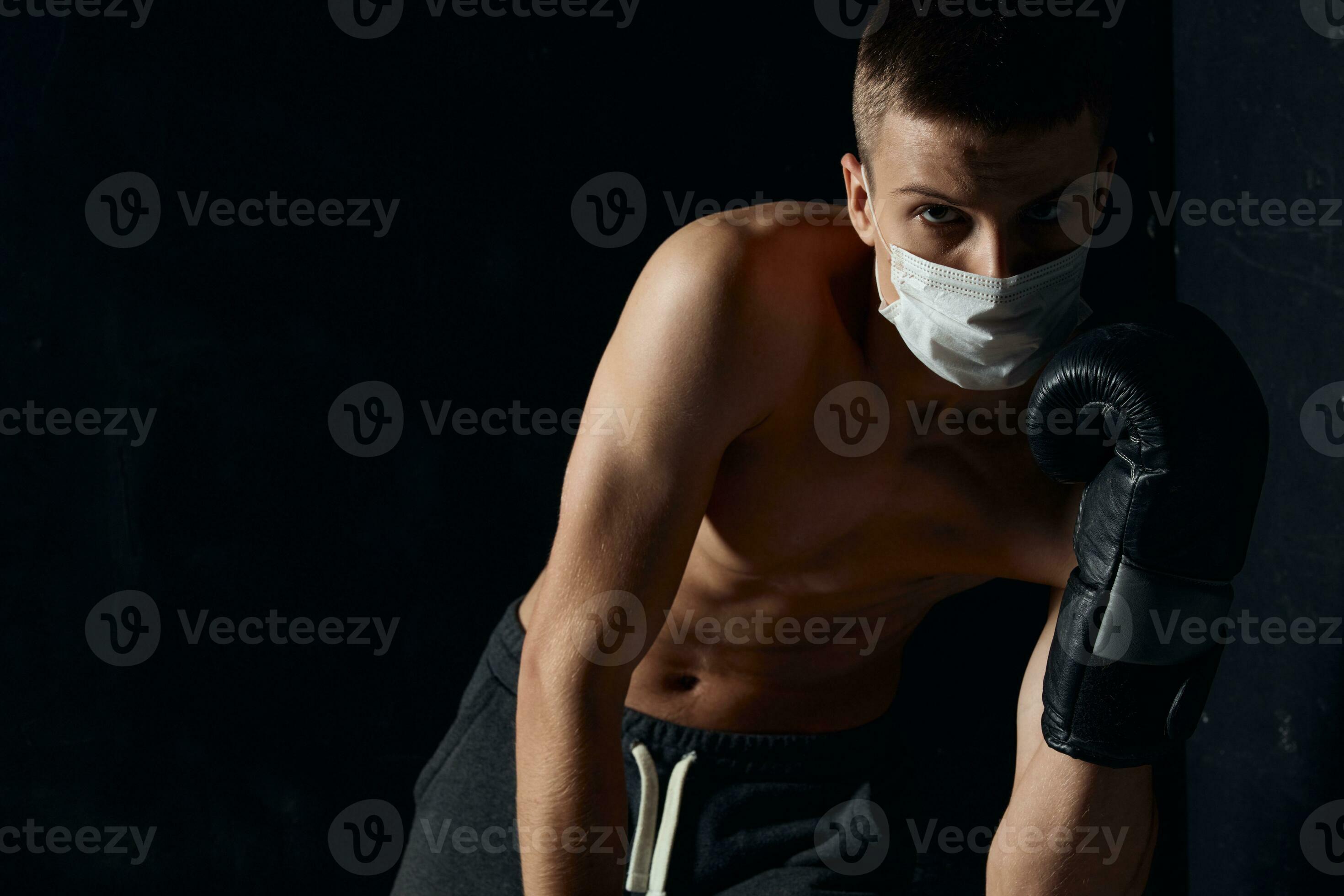athlete nudism guy in medical mask athlete nude torso bodybuilder black background  23687587 Stock Photo at Vecteezy