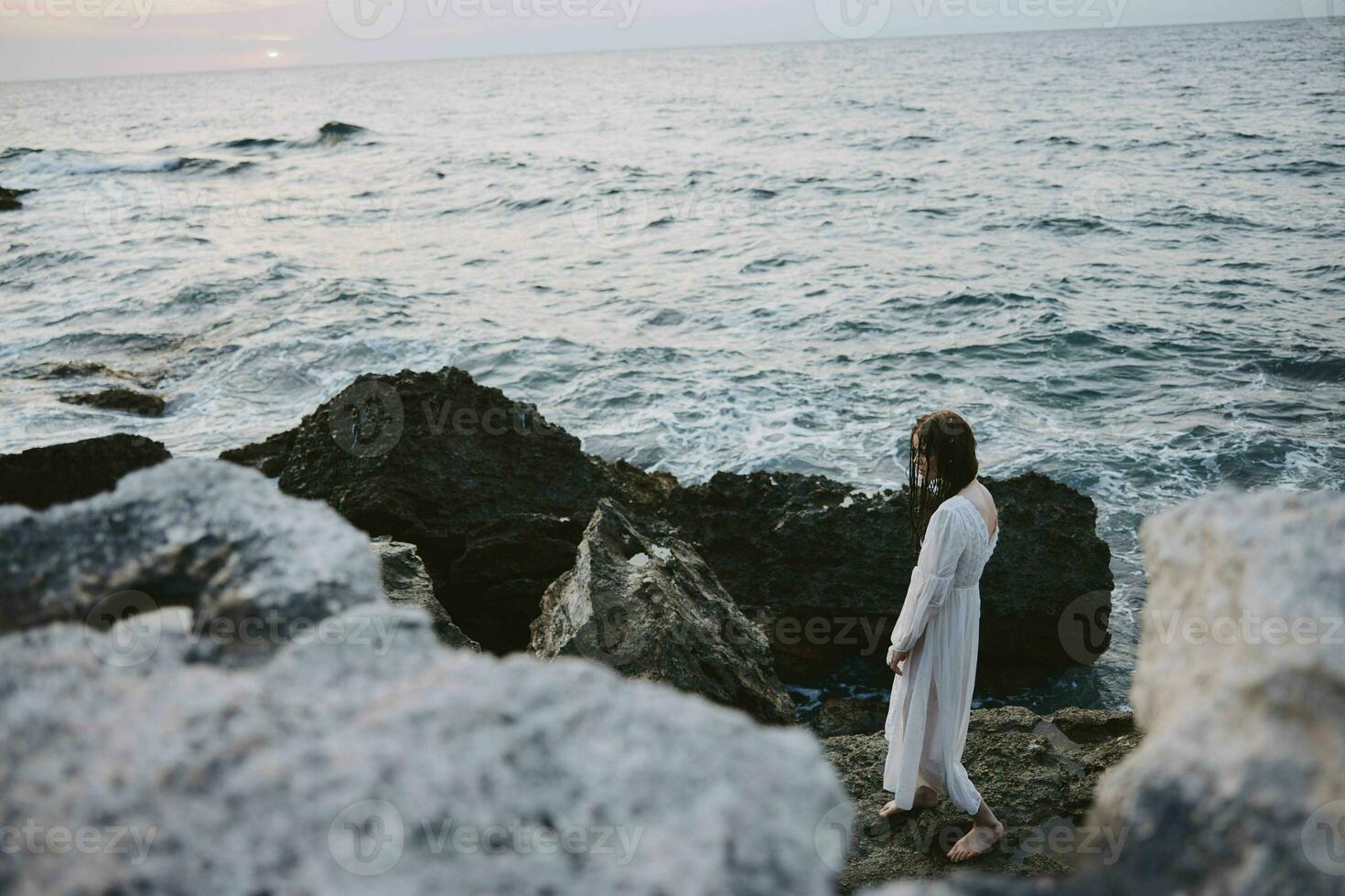 Beautiful woman enjoying for view of the beautiful sea on her holiday Lifestyle unaltered photo