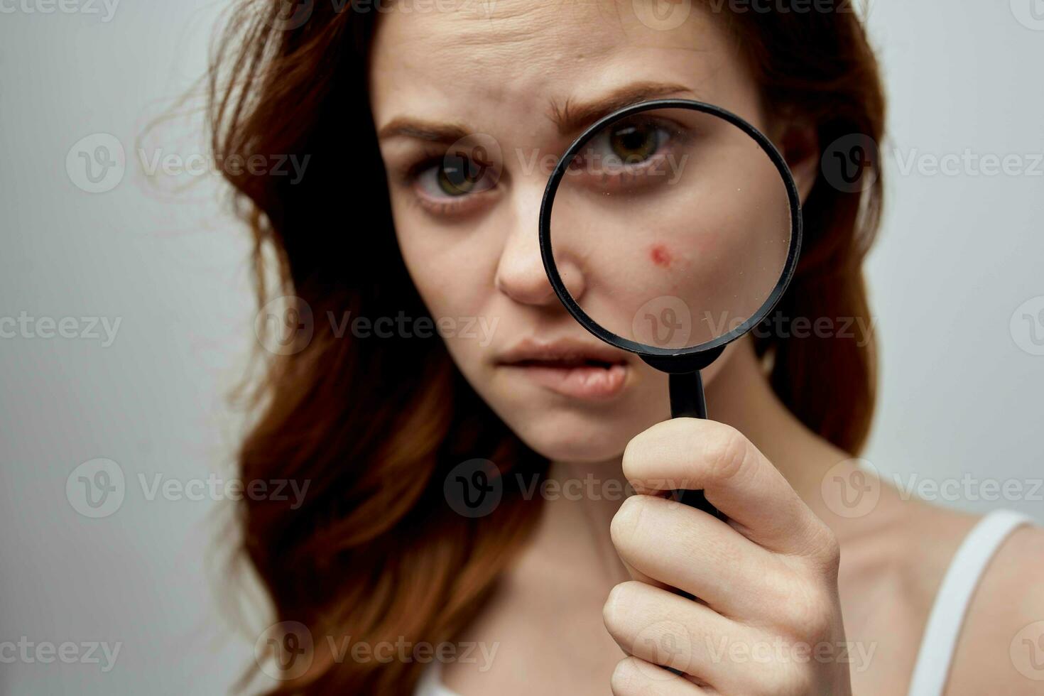 beautiful woman with a pimple on the face isolated background photo