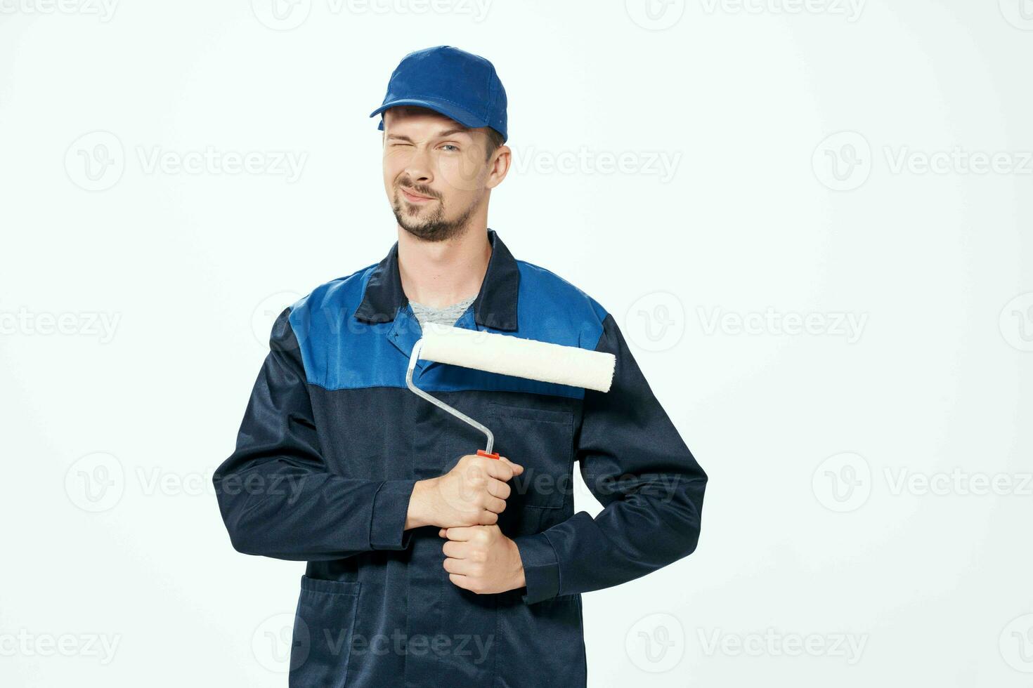 man in working uniform repair decoration work painter photo