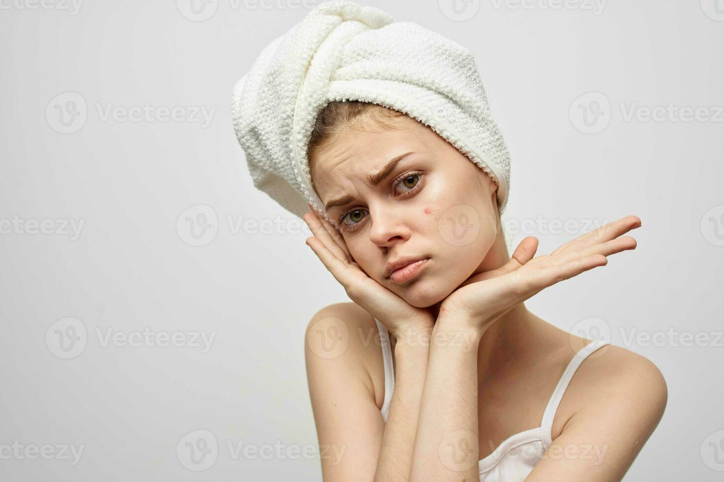 woman with a towel on my head skin problems close-up photo