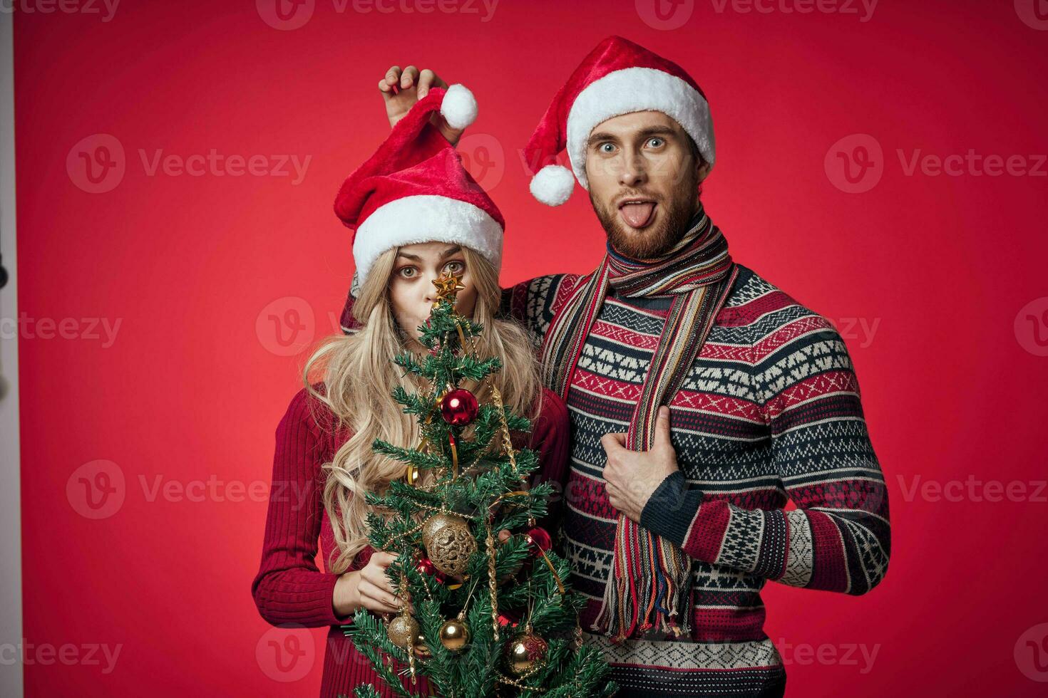 man and woman in New Year's clothes celebrate Christmas together photo