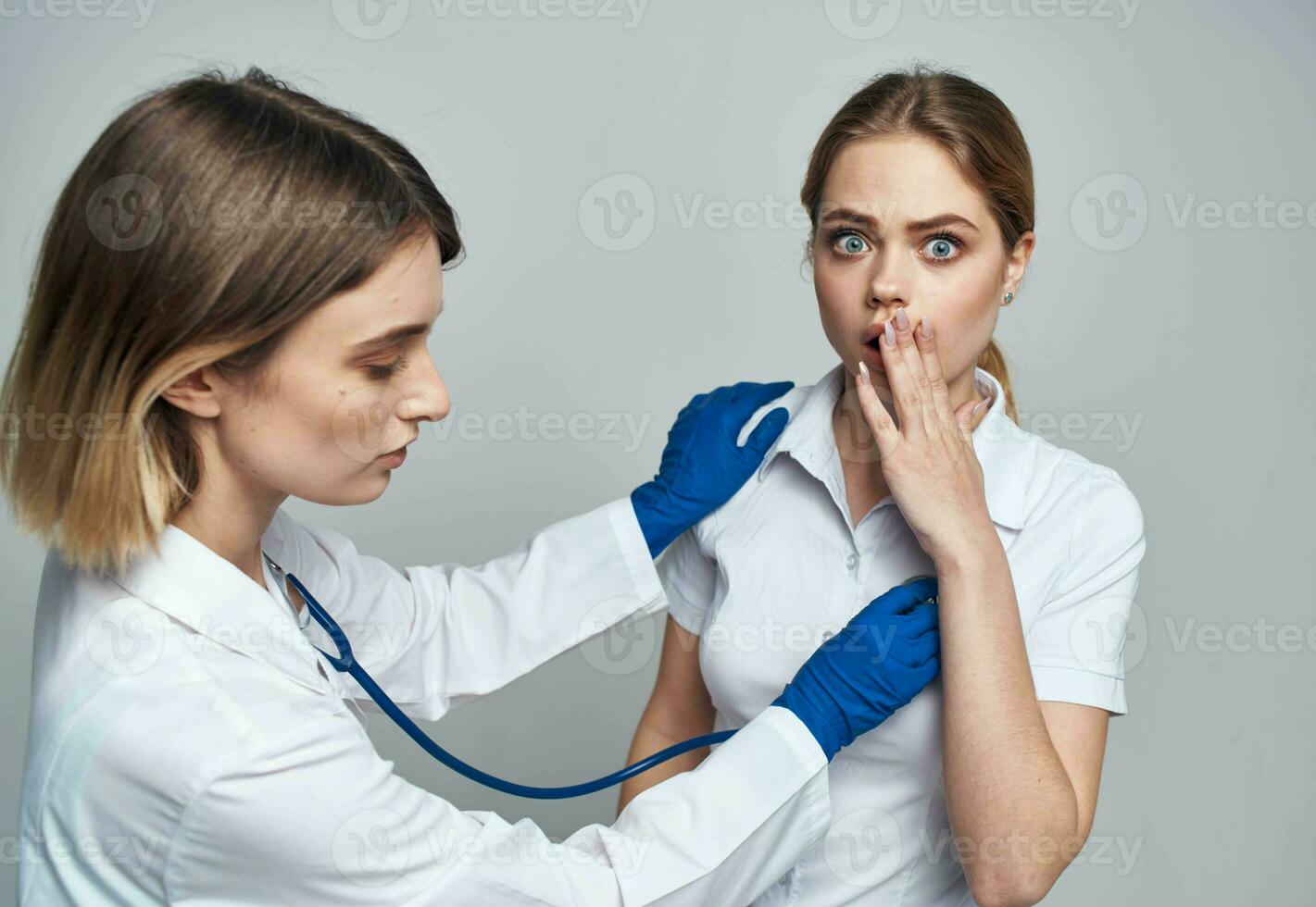 woman doctor examines patient health lifestyle stethoscope photo