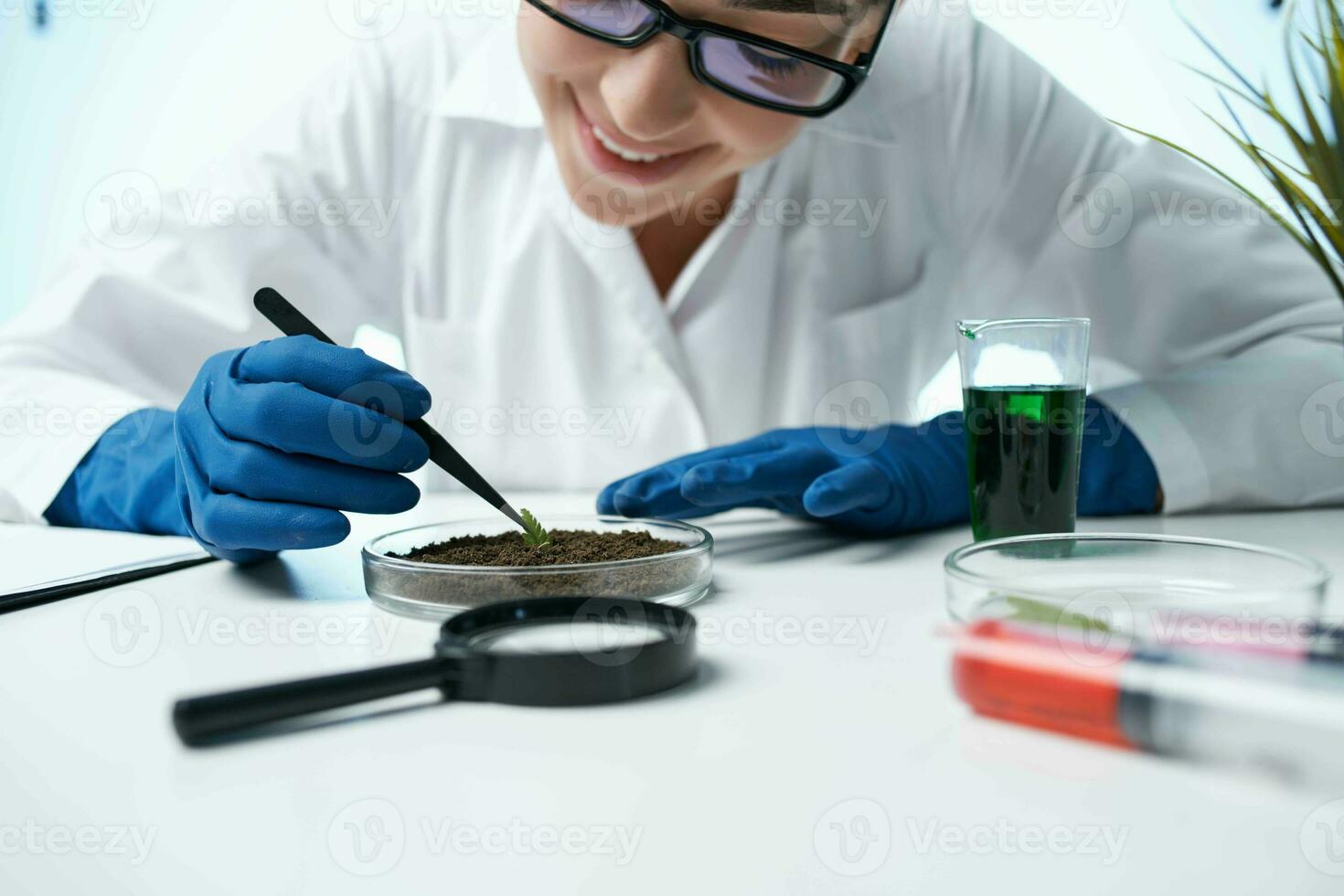 cheerful female biologist in a white coat scientist laboratory photo