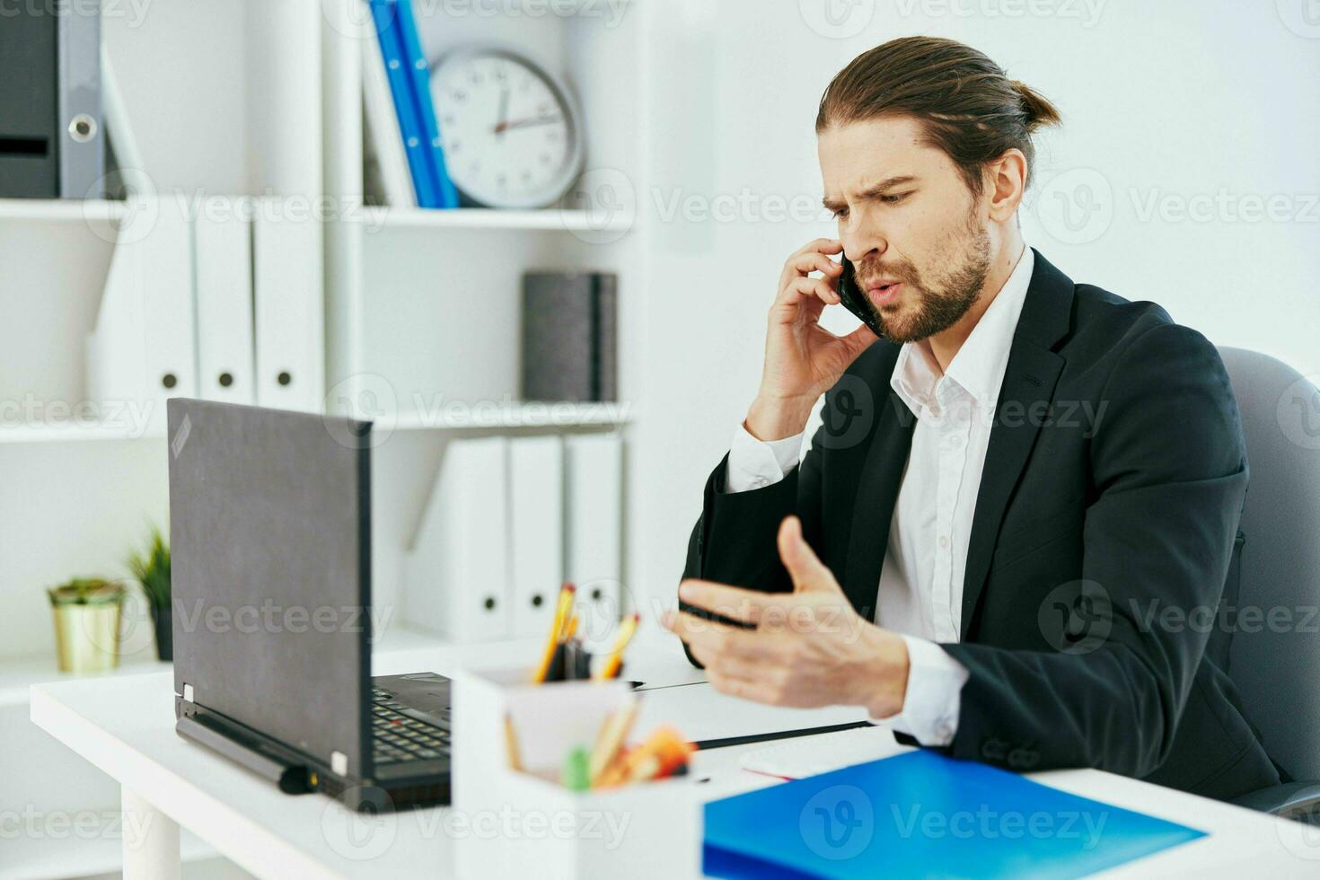 manager at the desk documents communication by phone boss photo