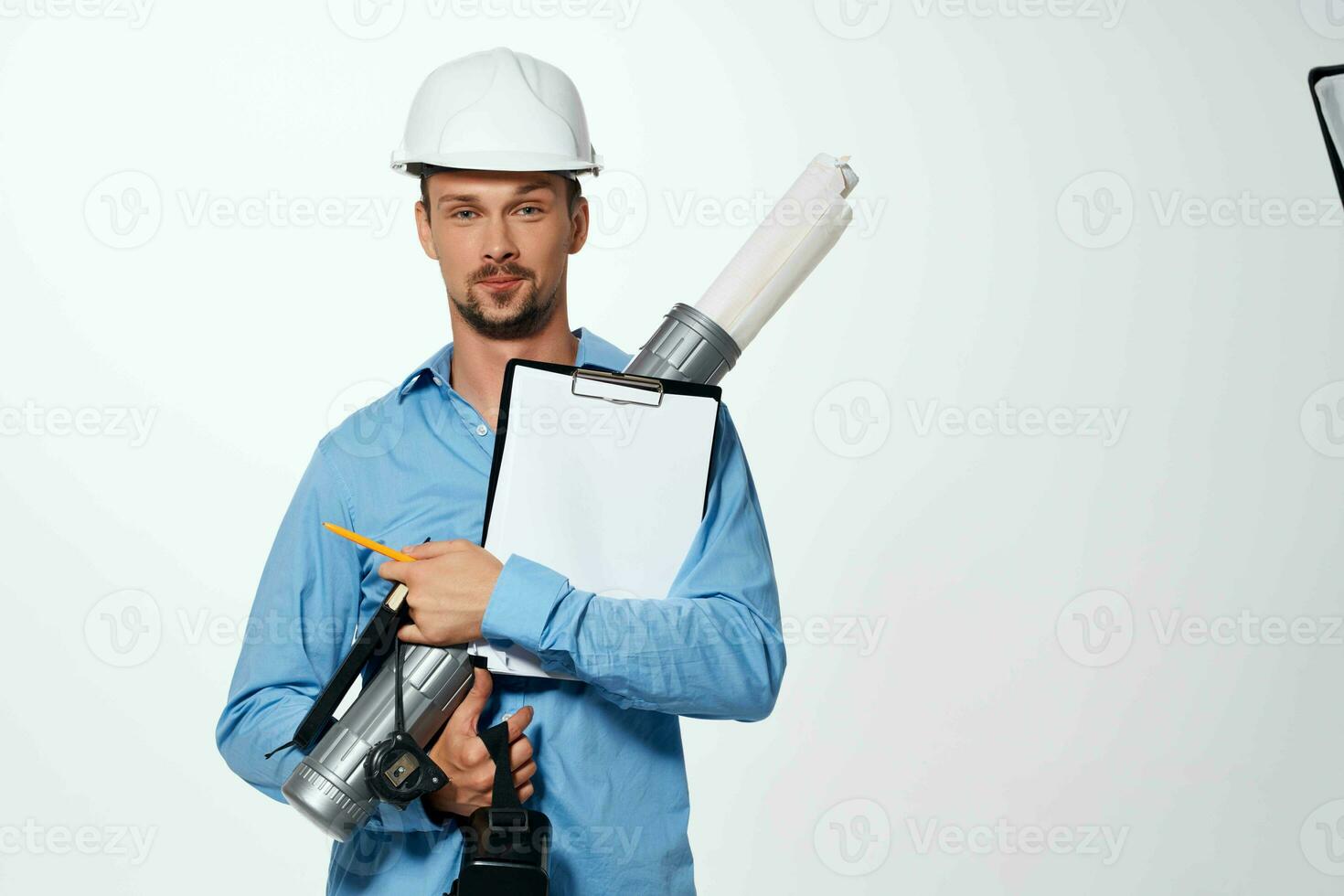 Cheerful man in construction uniform engineer work drawings professional photo