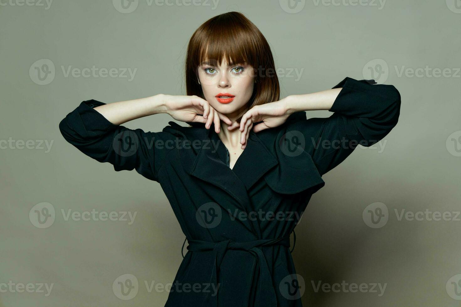 Adorable woman with red lips looking at the camera closeup photo