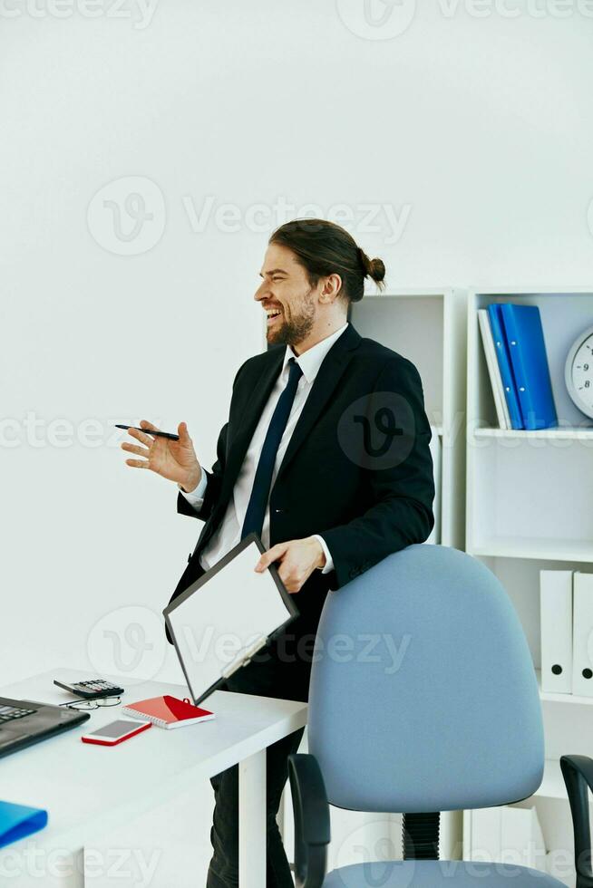 manager in the office with documents executive photo