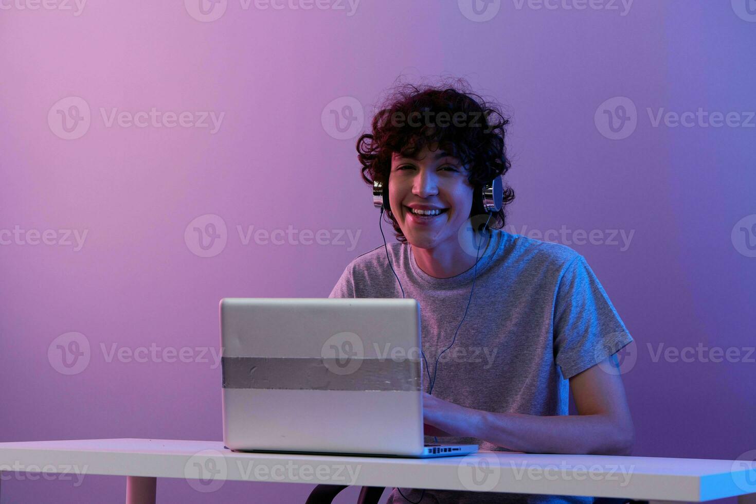 guy sitting at the table gaming laptop isolated background photo