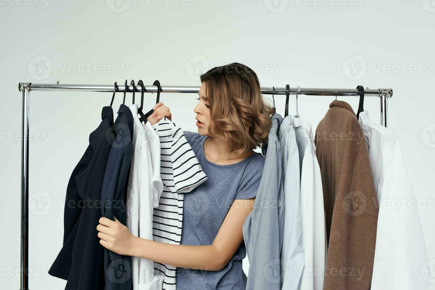beautiful woman clothes hanger shopping studio emotion photo
