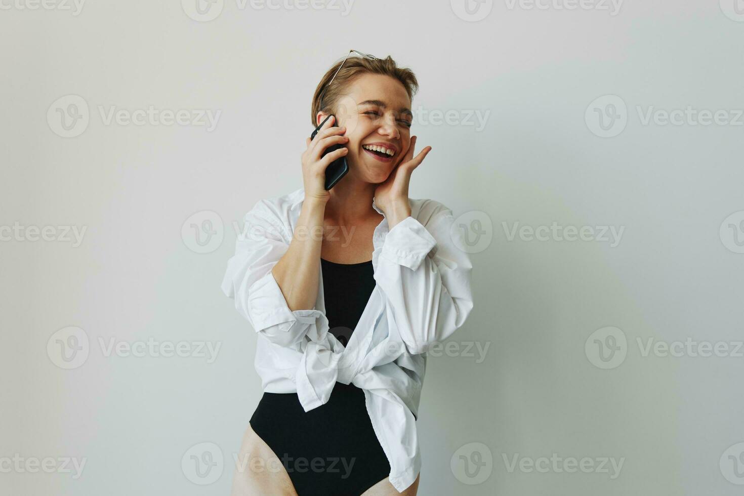 Teenage girl smiling and laughing talking on the phone, video call, chatting online photo