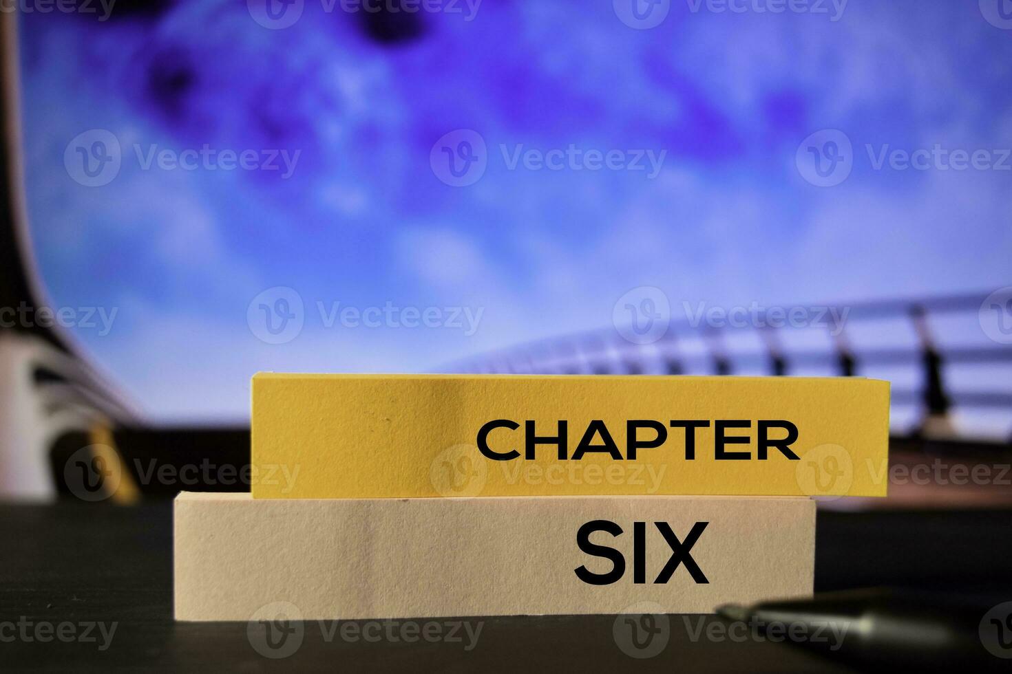 Chapter Six on the sticky notes with bokeh background photo