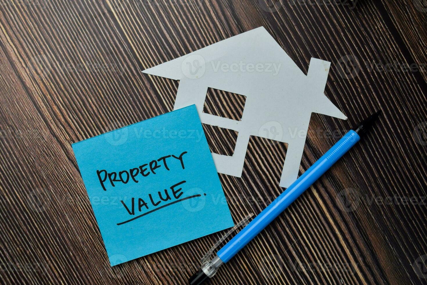 Property Value write on sticky notes isolated on office desk. photo