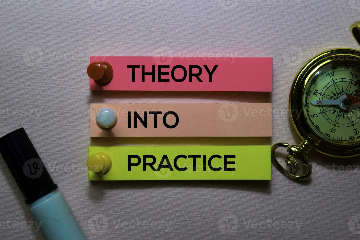 Theory Into Practice text on sticky notes isolated on office desk photo
