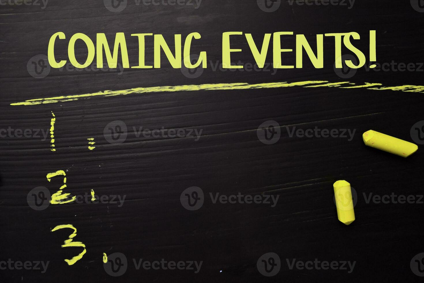 Coming Events written with color chalk. Supported by an additional services. Blackboard concept photo