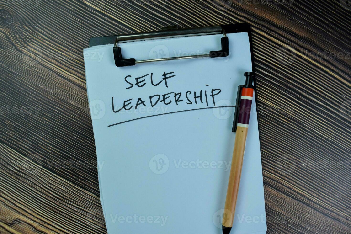 Concept of Self Leadership write on paperwork isolated on Wooden Table. photo