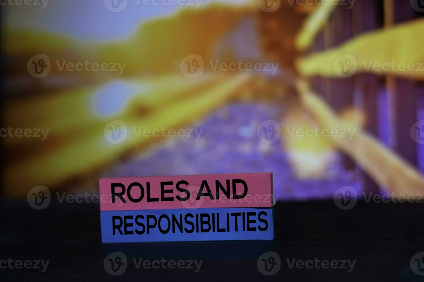 Roles and Responsibilities on the sticky notes with bokeh background photo