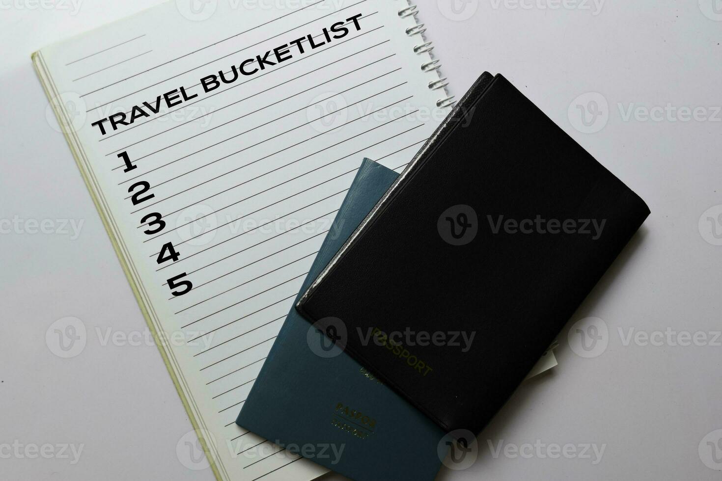 Passports and Travel Bucketlist write on a book isolated white background. holiday concept photo