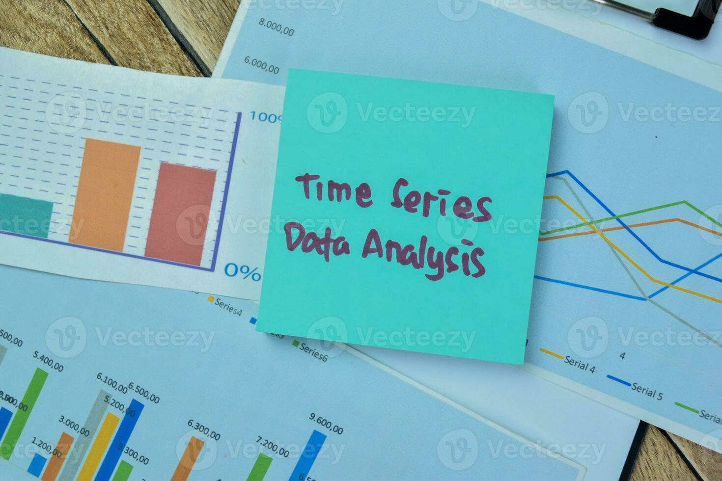 Concept of Time Series Data Analysis write on sticky notes isolated on Wooden Table. photo