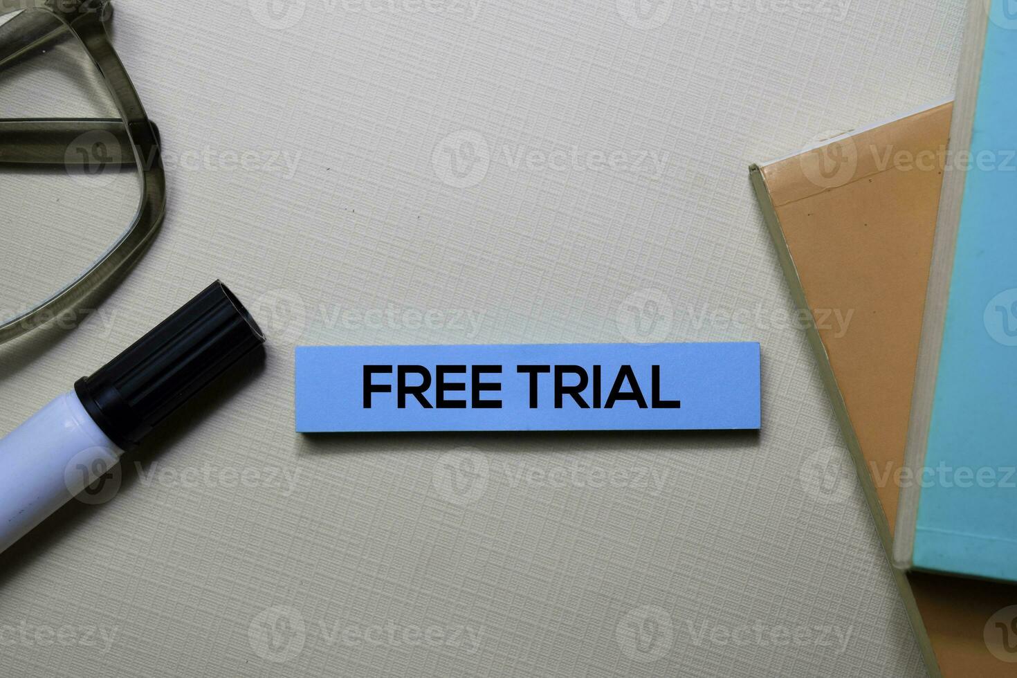 Free Trial text on sticky notes isolated on office desk photo