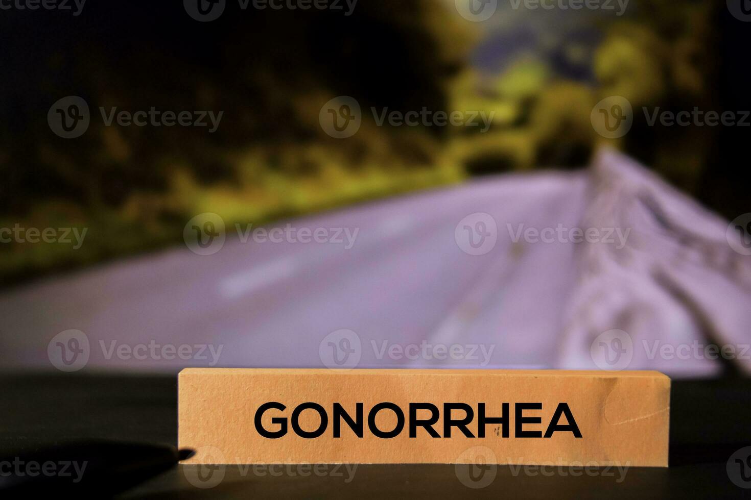 Gonorrhea on the sticky notes with bokeh background photo