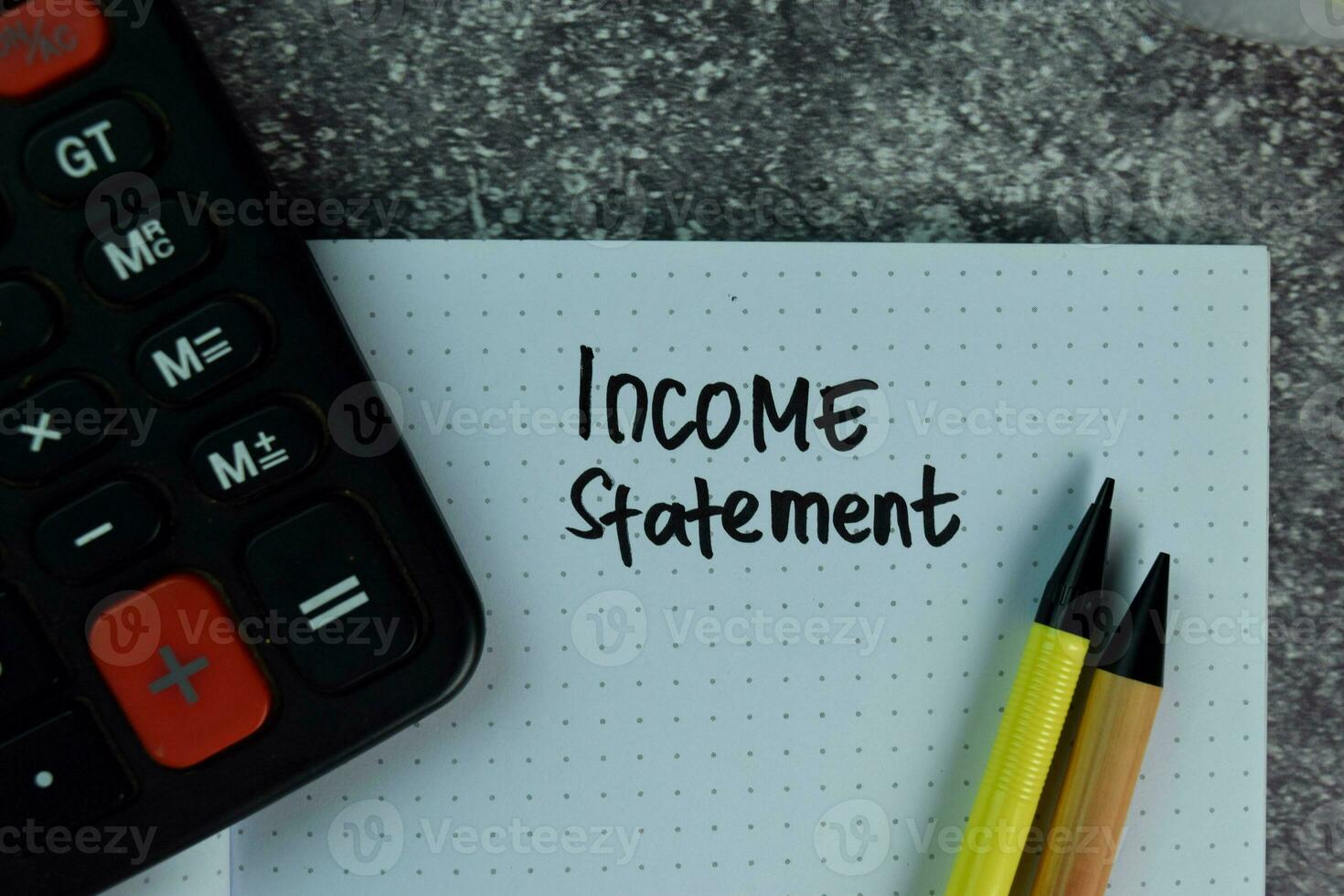 Income Statement write on a book on the table. photo