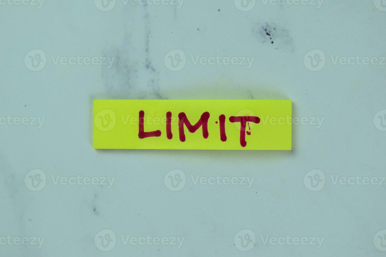 Concept of Limit write on sticky notes isolated on Wooden Table. photo