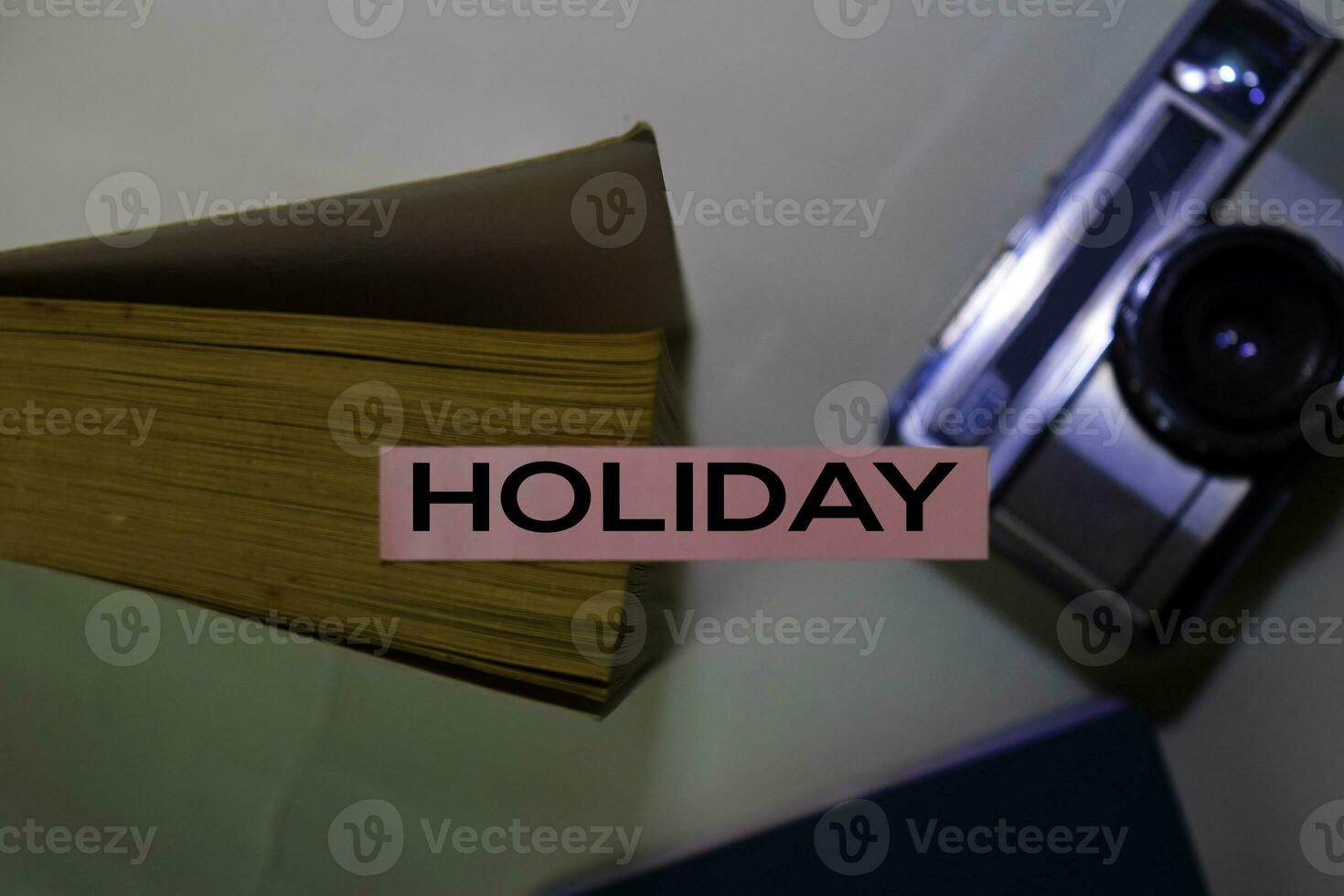 Holiday text on sticky notes isolated on desk background photo