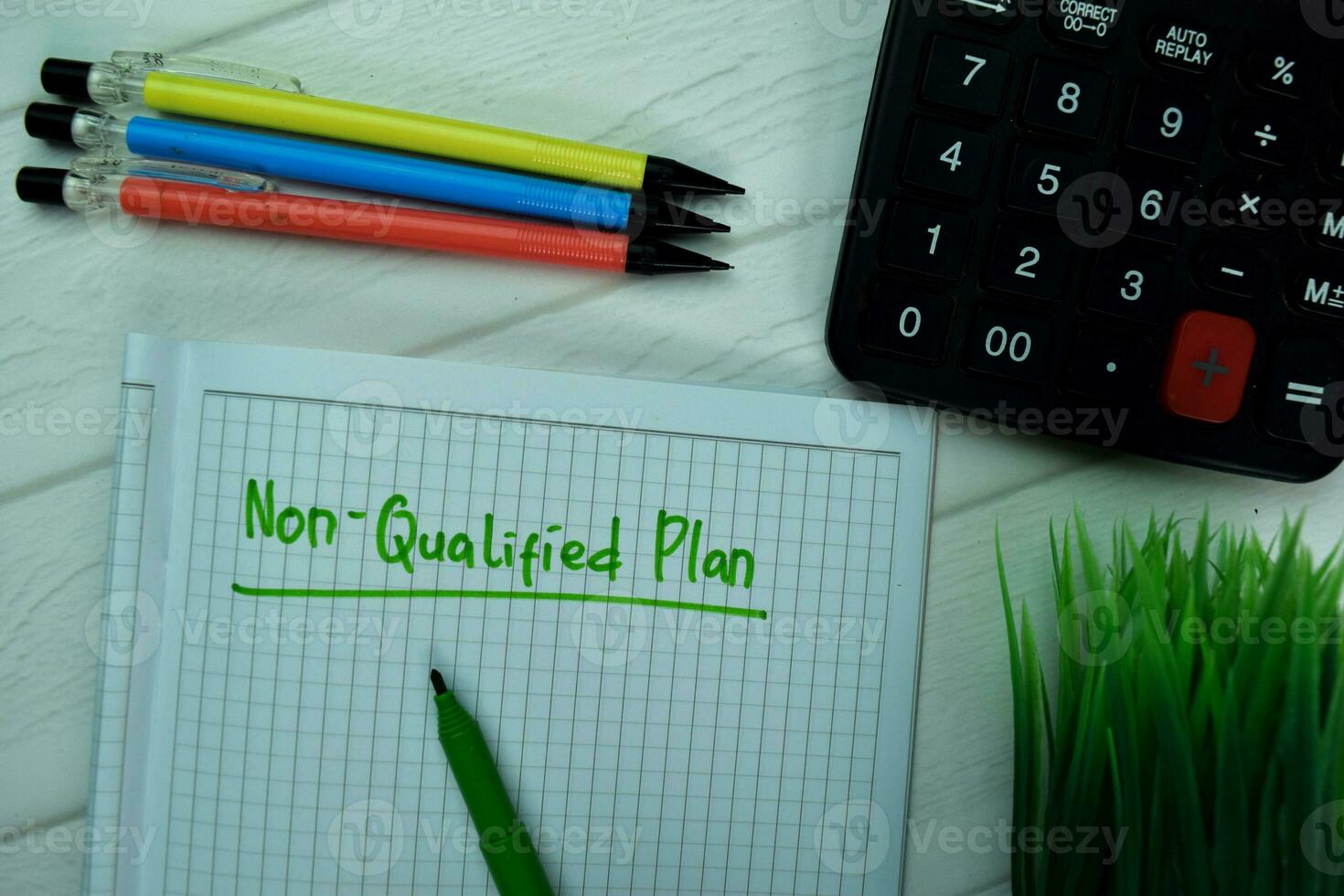 Non-Qualified Plan write on a book isolated on office desk. photo