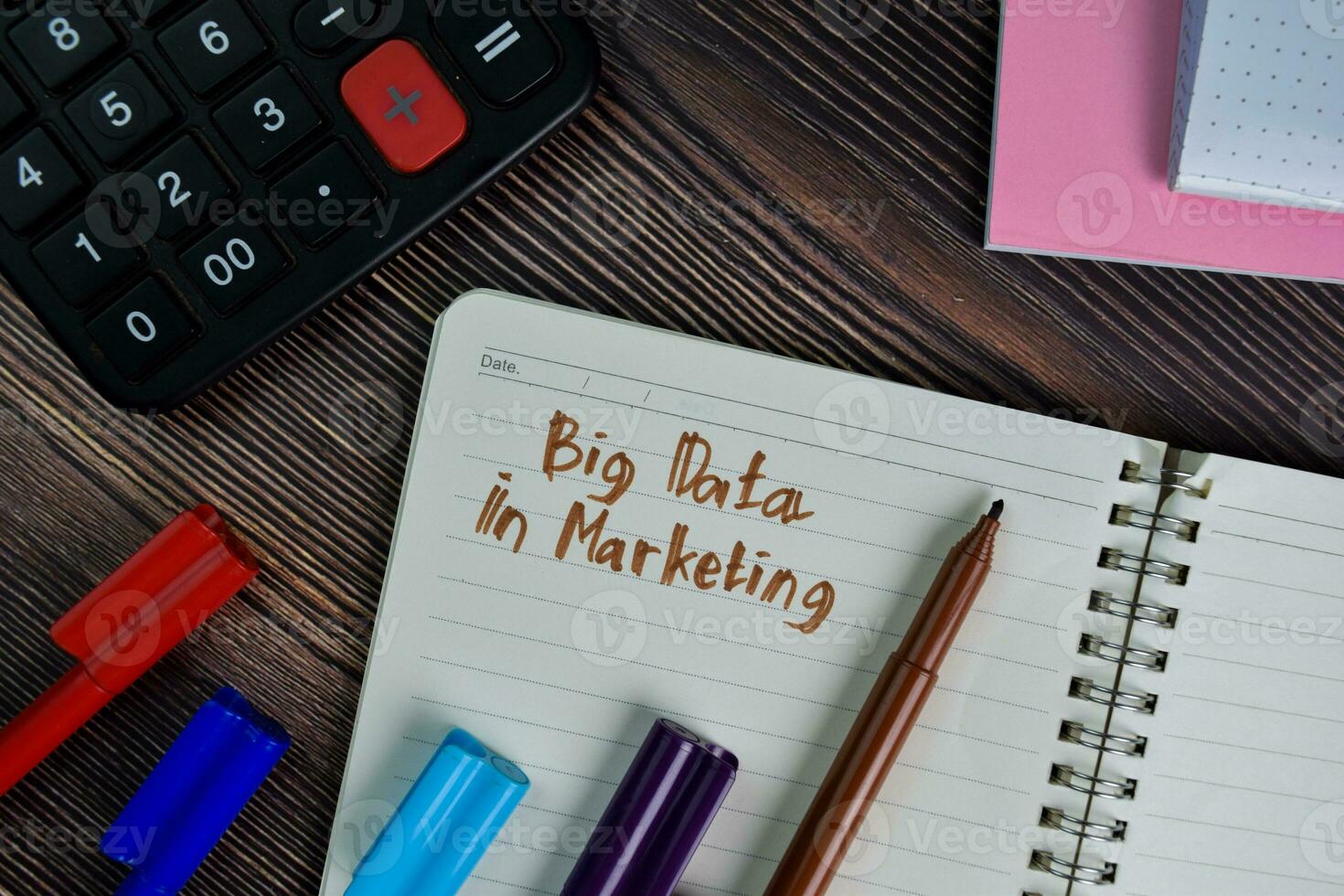 Bigdata in Marketing write on a book isolated wooden table. photo
