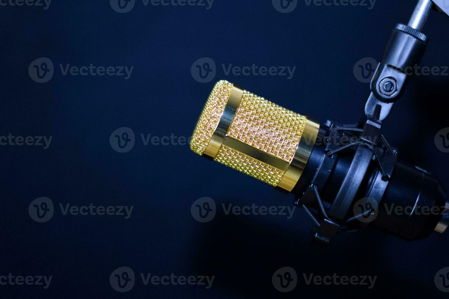 Close-up of retro microphone isolated on bokeh black background photo
