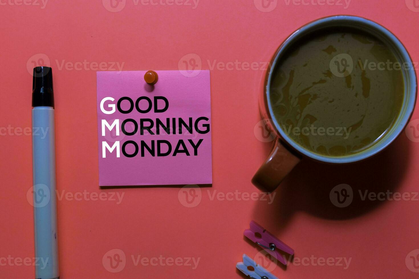GMM. Good Morning Monday acronym on sticky notes. Office desk background photo