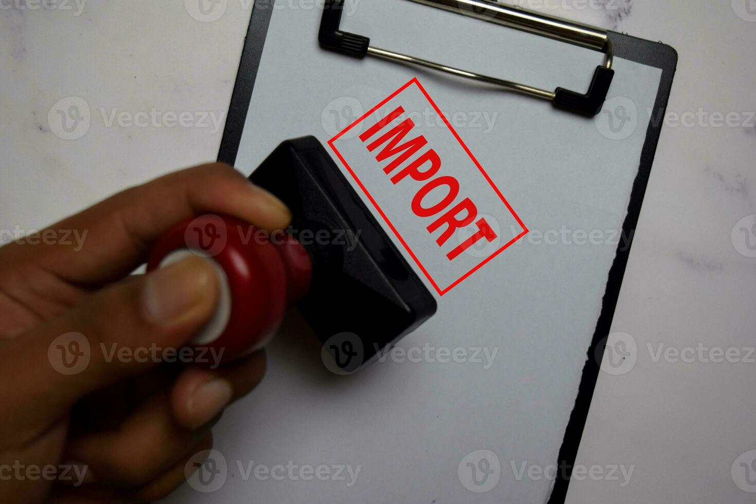 Close up Red Handle Rubber Stamper and text import isolated on White Background. photo
