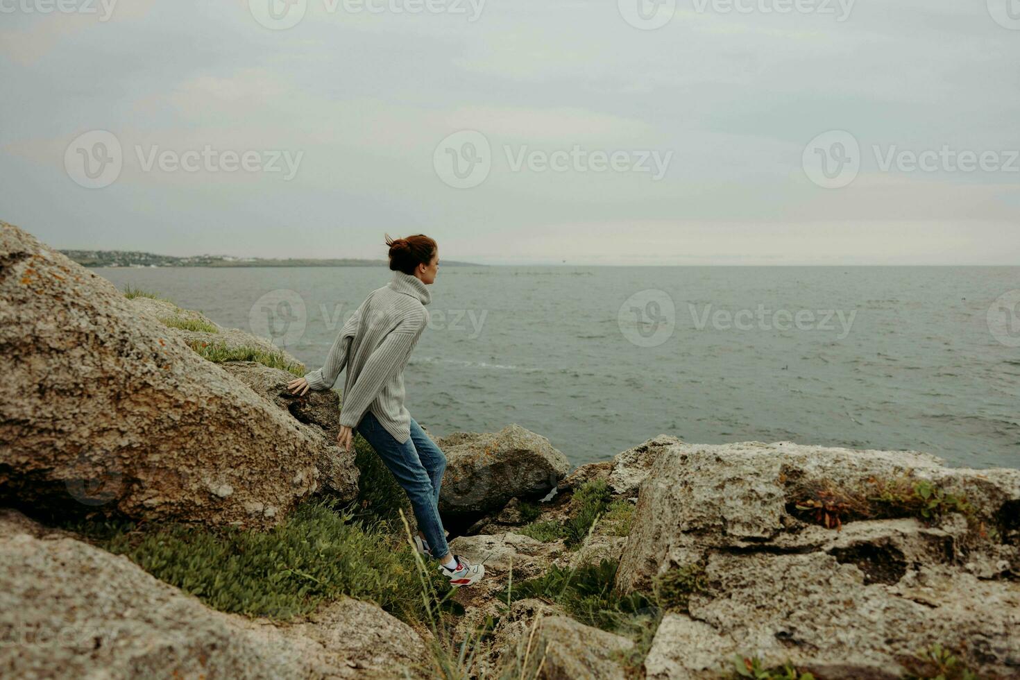 portrait of a woman freedom walk on the stone coast unaltered photo