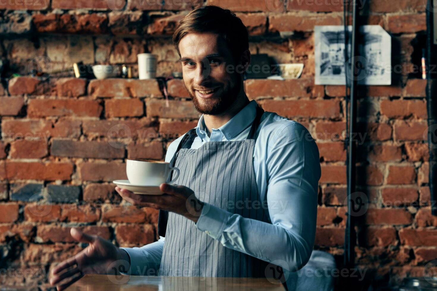 male waiter wearing apron coffee cup service lifestyle photo