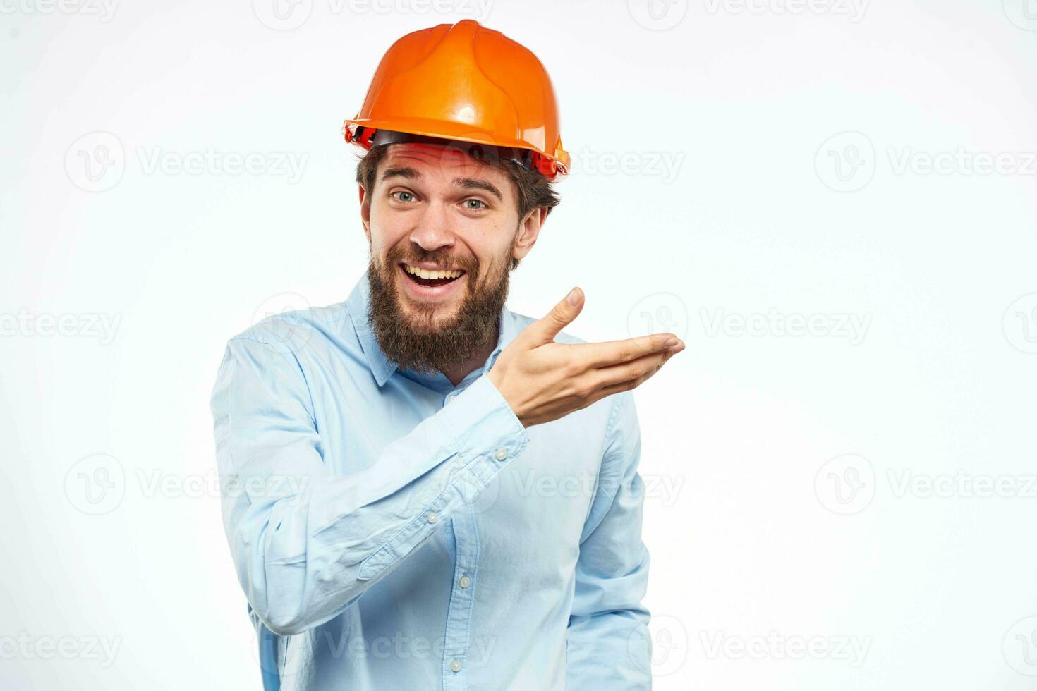 Emotional man in blue shirt orange helmet industry security Professional photo