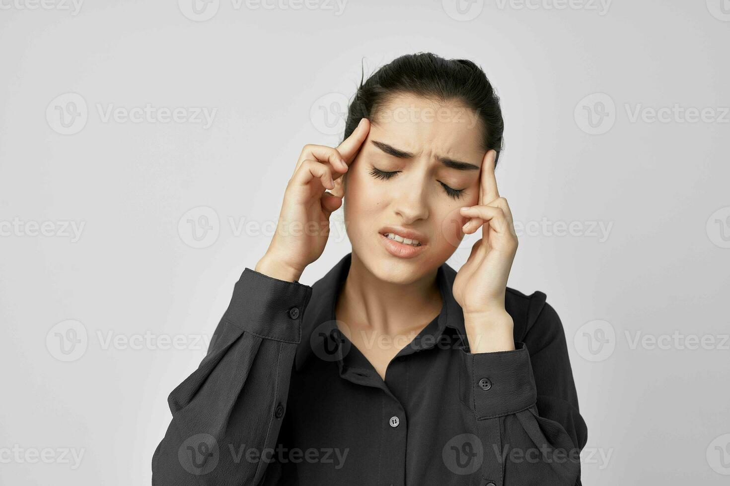 brunette migraine stress negative light background photo