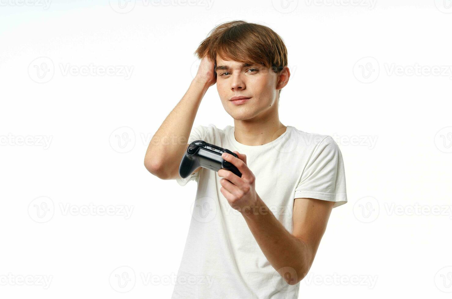a man in a white t-shirt with a joystick in his hands playing hobby lifestyle photo