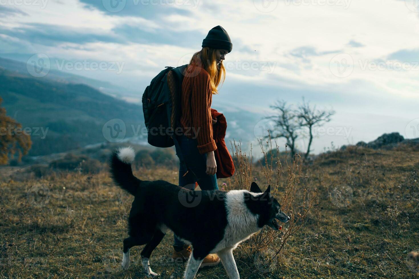 woman hiker dog walking nature mountains landscape photo