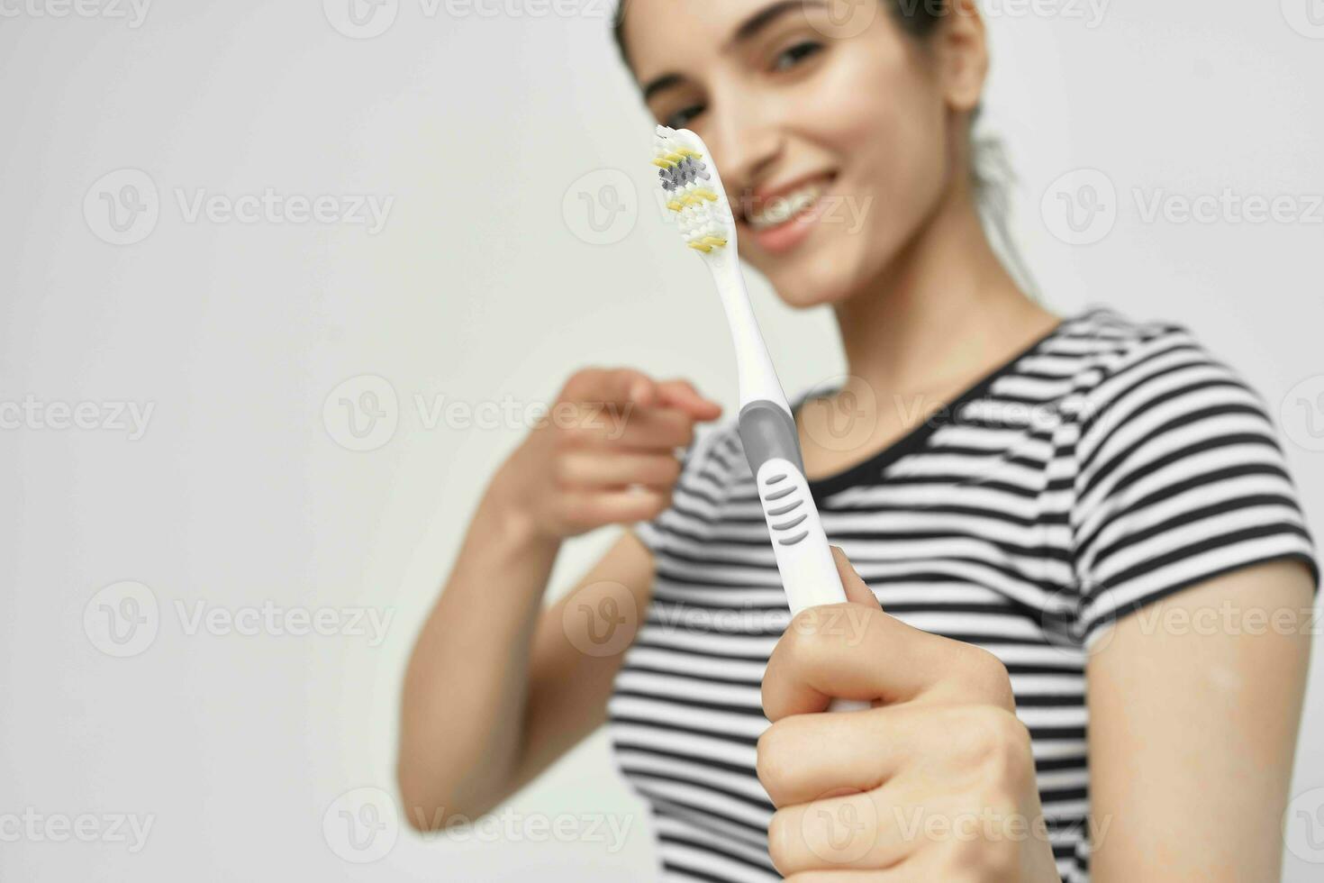 cheerful woman hygiene teeth cleaning care health light background photo