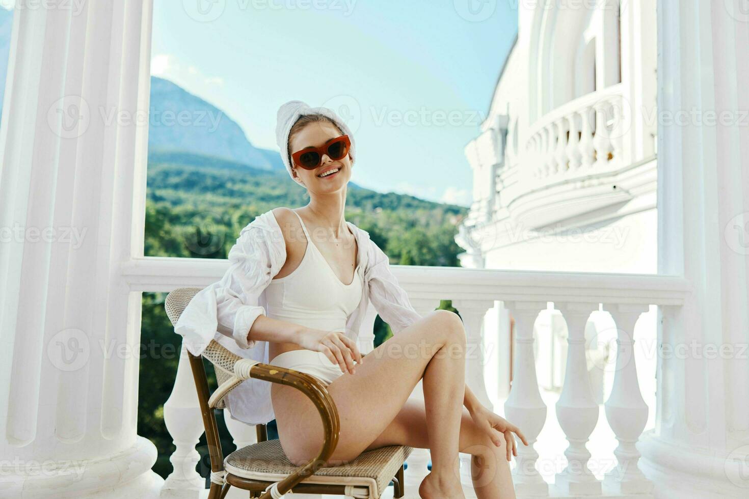 Attractive young woman wearing white shirt and towel on head while relaxing at home Mountain View photo