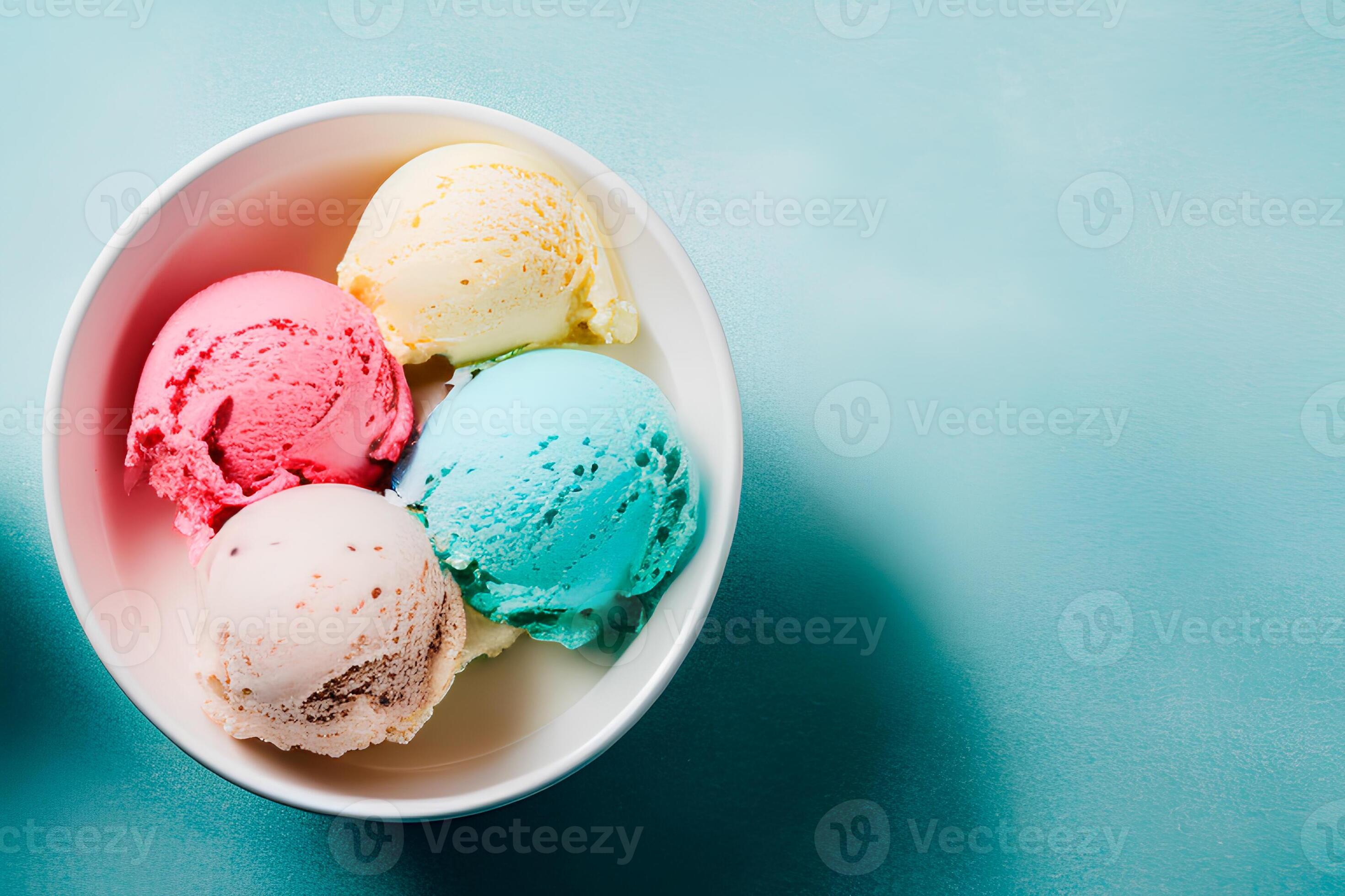 A bowl of colorful ice creams on a blue background, ice cream balls in