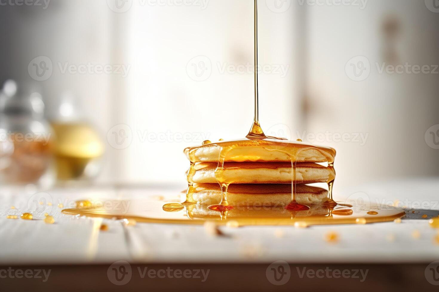 Honey flowing on a tasty panckakes. . photo