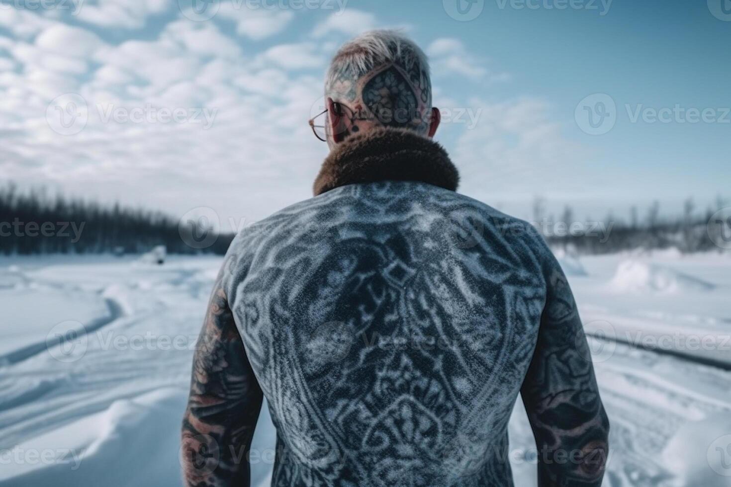 Icelandic man with his back covered in tattoos outside in frozen winter. photo