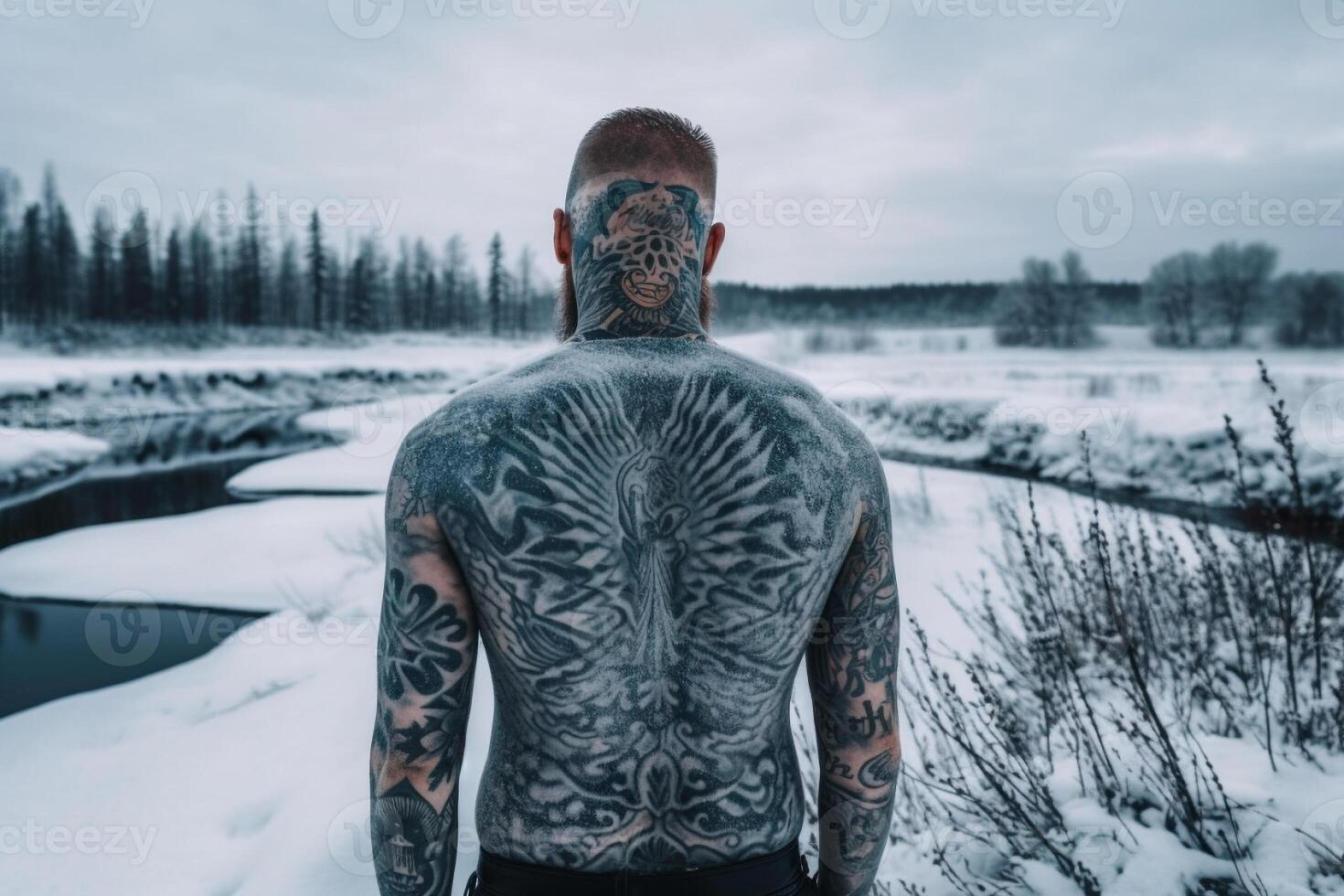 Icelandic man with his back covered in tattoos outside in frozen winter. photo