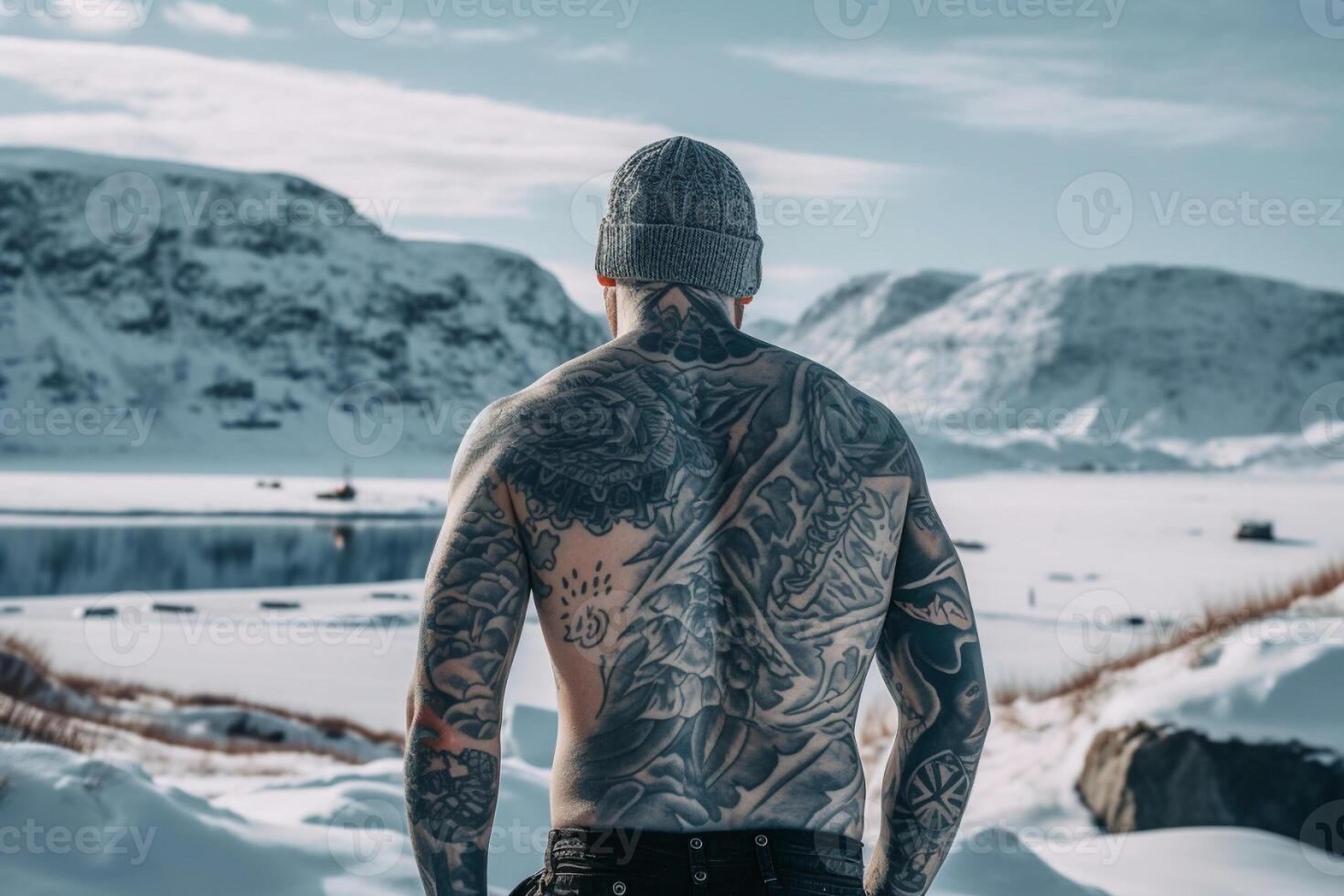 Icelandic man with his back covered in tattoos outside in frozen winter. photo